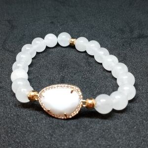 Stretchy moonstone and rhinestone with decorative Center bracelet.